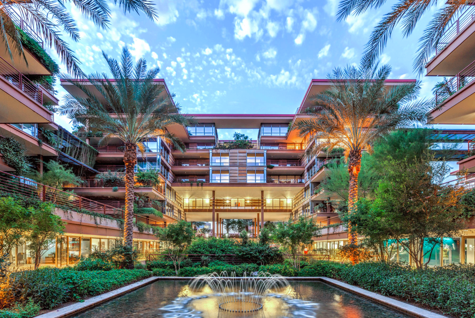 Residential concierge welcoming residents in an apartment lobby